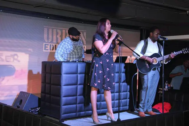 Vocalist and band on stage