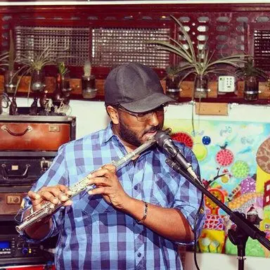 Flute performance against a painted backdrop