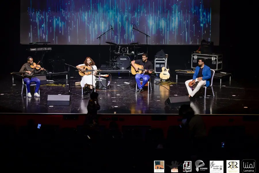 Ensemble performing on a theatre stage