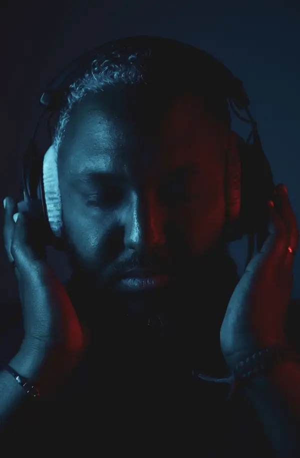 Shaf Ahmed in blue studio light
