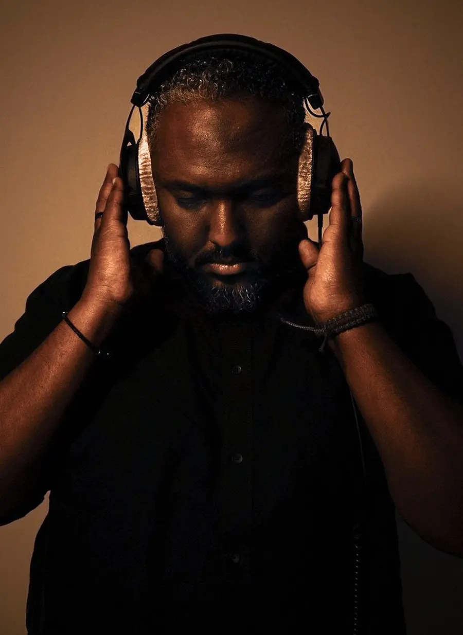 Ahmed Elshafea wearing studio headphones