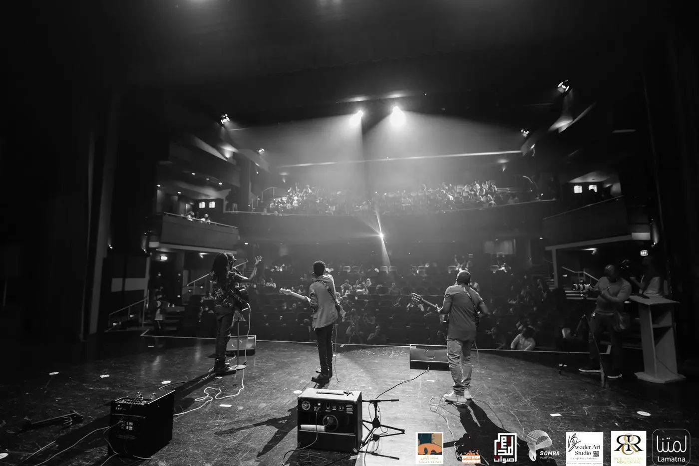 Black and white photo of a performance from the stage
