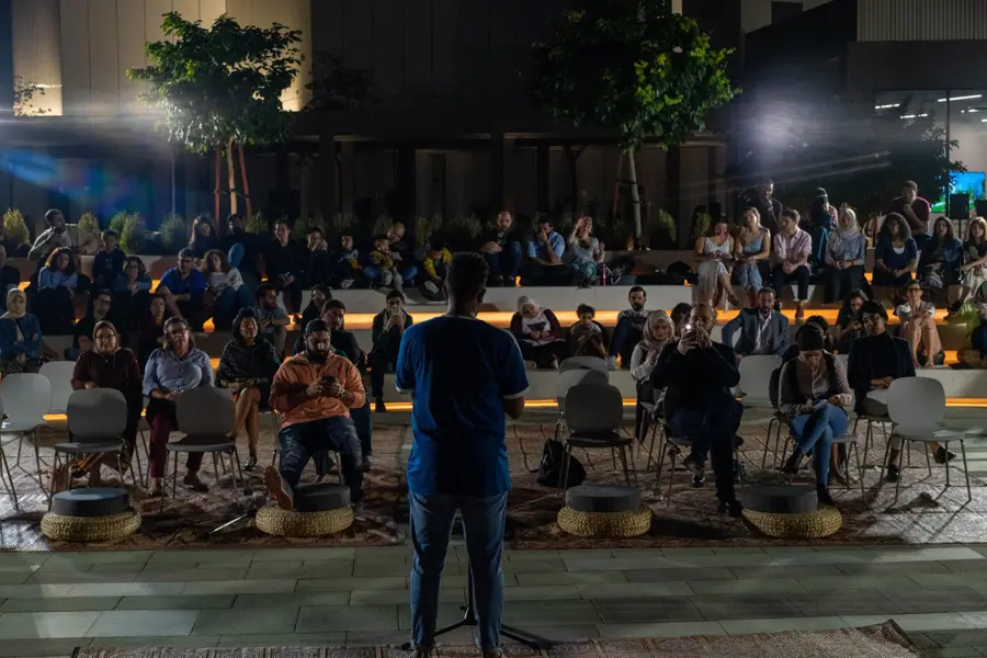 Outdoor audience at an evening performance