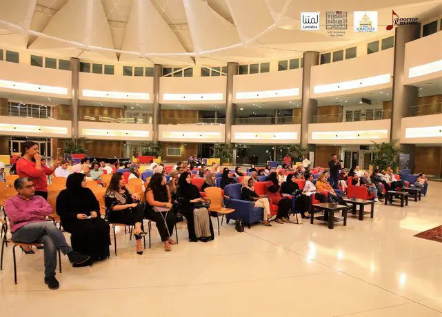 Full auditorium at a cultural event